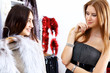 Young woman inside a store buying clothes