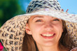 Young woman wearing sun hat