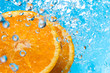 Orange splash in water, top view Orange splash in water, top view