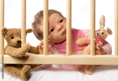 Photo: Baby in Cot Baby in Cot