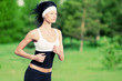 Woman running in green park