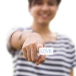 Woman pressing love button Woman pressing love button