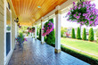 Photo: American Country farm luxury house with porch. American Country farm luxury house with porch.