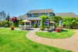 Photo: American Country farm luxury house with porch. American Country farm luxury house with porch.
