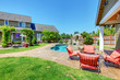 Photo: American Country farm luxury house with porch. American Country farm luxury house with porch.