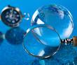 Travelling, magnifying glass and globe