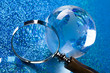Travelling, magnifying glass and globe