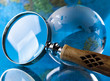 Globe and Magnifying glass