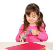 Little Girl Cutting with Scissors