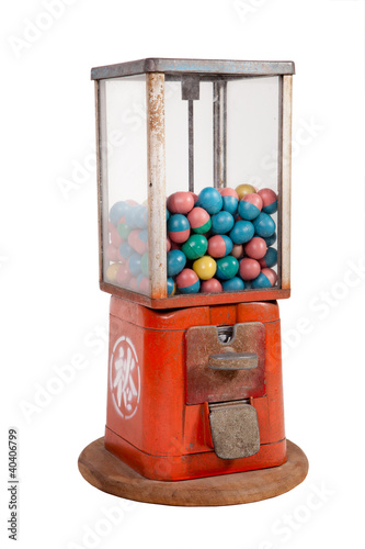 Photo: Old dispenser with colorful eggs inside on white background Old dispenser with colorful eggs inside on white background