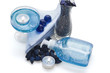 Photo: body care liquid, candle and a blue pebble for spa treatment body care liquid, candle and a blue pebble for spa treatment