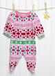 Pink Baby sleeper with Pacifier Dummy on a Clothesline. Pink Baby sleeper with Pacifier Dummy on a Clothesline.