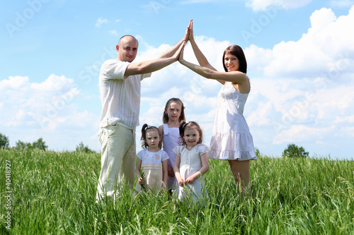 Photo: family with children in summer day outdoors family with children in summer day outdoors