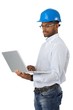 Engineer in hardhat with computer Engineer in hardhat with computer