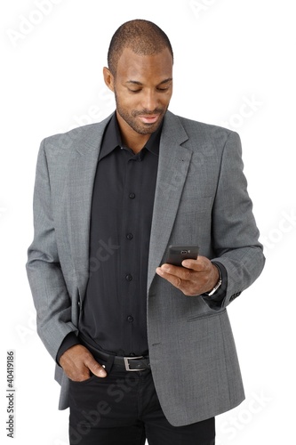 Photo: Handsome businessman texting Handsome businessman texting