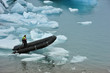 a man on rubber boat on Jokulsarlon Glacier Lake, Iceland