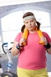 Exhausted fat woman at the gym