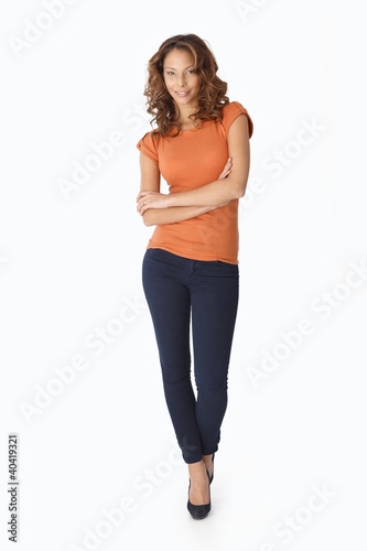 Foto: Pretty female standing arms crossed Pretty female standing arms crossed