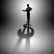 Illustration: Businessman with shadow as a currency symbol Businessman with shadow as a currency symbol