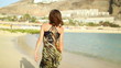 Woman walking on the beach, slow motion, steadicam shot