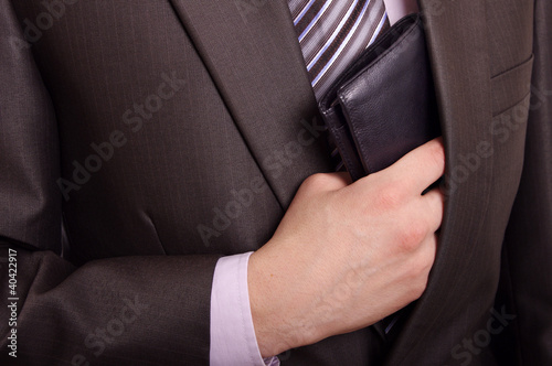 Photo: man taking wallet man taking wallet