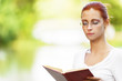 beautiful woman reads book carefully