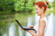 beautiful woman typing on laptop keyboard
