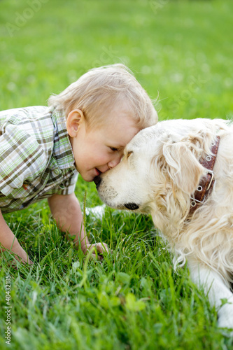 Photo: Boy with retriever outdoor Boy with retriever outdoor