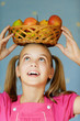 Girl-teenager keeps on his head basket
