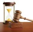 Hourglass and gavel isolated on white