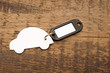 model car with blank tag on wooden background. space for your te