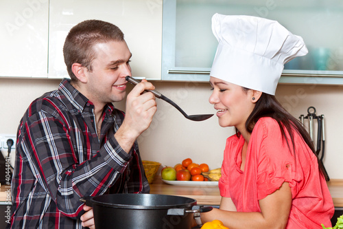 Photo: Happy couple cooks together Happy couple cooks together