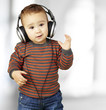 portrait of adorable kid with headphones listening to music indo portrait of adorable kid with headphones listening to music indo