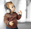 portrait of adorable kid with headphones listening to music indo portrait of adorable kid with headphones listening to music indo