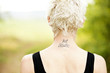 Photo: Female runner with tattoo on her neck Female runner with tattoo on her neck