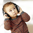 portrait of a handsome kid listening to music looking up indoor portrait of a handsome kid listening to music looking up indoor
