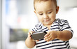 portrait of funny kid playing with mobile indoor portrait of funny kid playing with mobile indoor