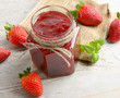 strawberries marmalade on a wooden table