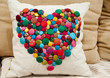 Cushion embellished with colourful buttons