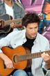Young man playing guitar