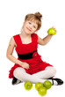 Little pretty girl with green apples