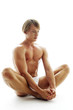 Photo: A shirtless man in white underwear sitting on the floor with his hands touching his feet. A shirtless man in white underwear sitting on the floor with his hands touching his feet.