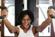 Photo: A african american man pulling with all his might during a powerlifting training. A african american man pulling with all his might during a powerlifting training.
