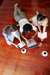 Top view of a african american guy and two ladies doing work on the floor.