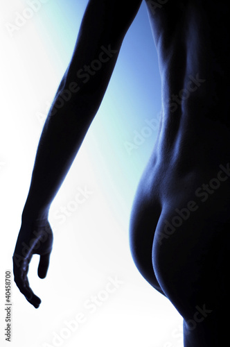 Foto: Back shot of a naked woman's buttock. Back shot of a naked woman's buttock.