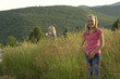 a girl in a grassland. 