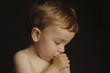 a boy sucking his thumb.