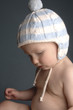 a baby wearing a bonnet.