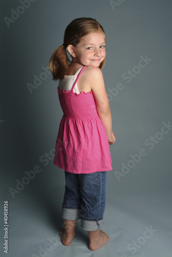 Photo: a girl looking shy. a girl looking shy.