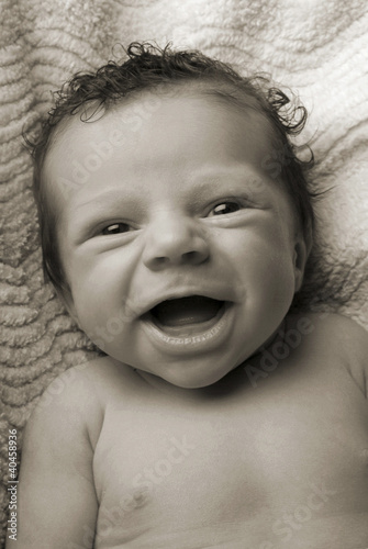 Photo: a baby smiling. a baby smiling.
